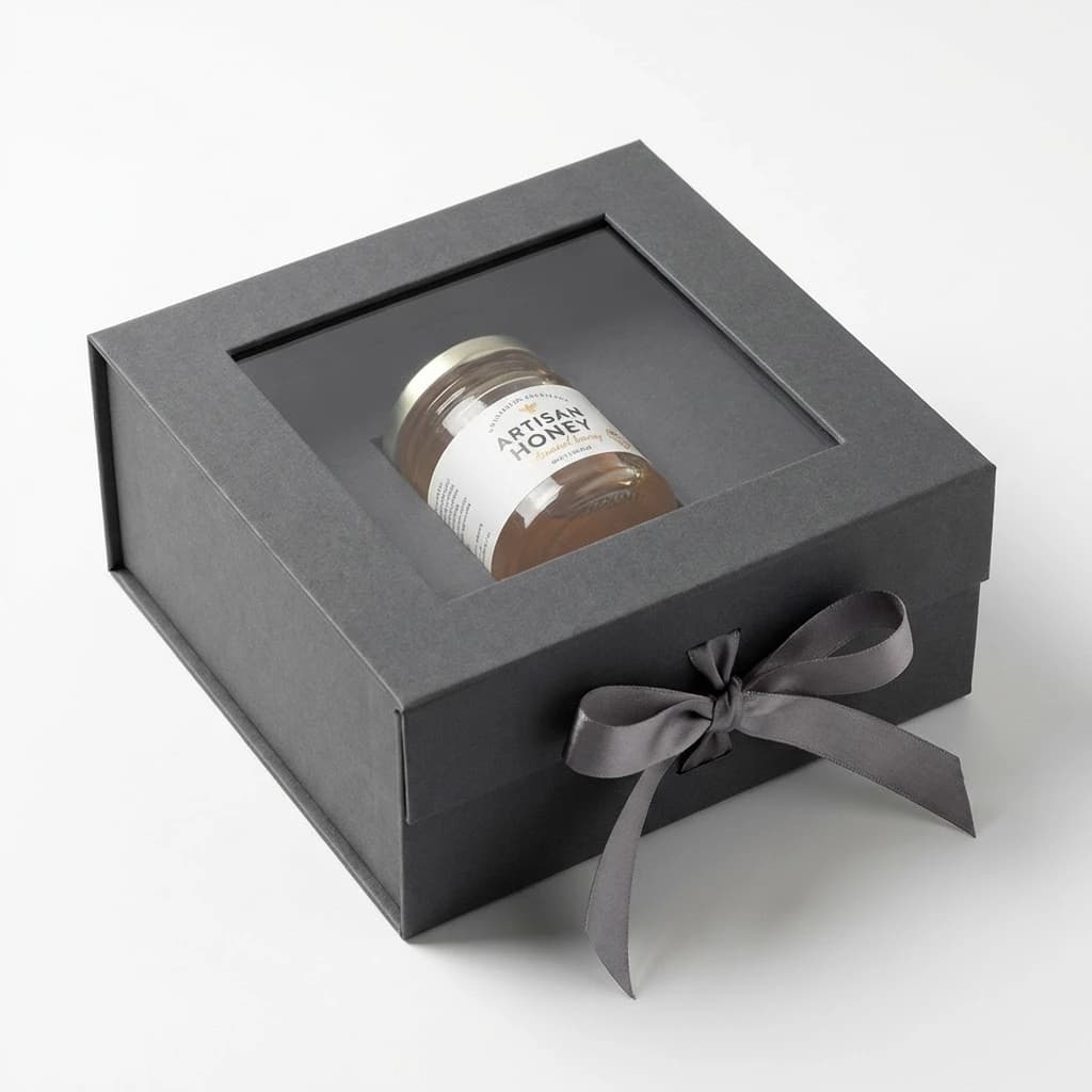 Rigid gift box with window cut-out showing product inside for luxury retail packaging